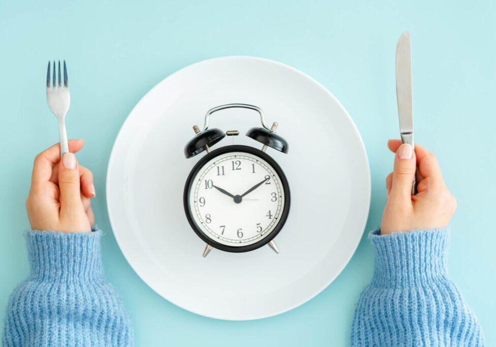Clock on plate with utensils
